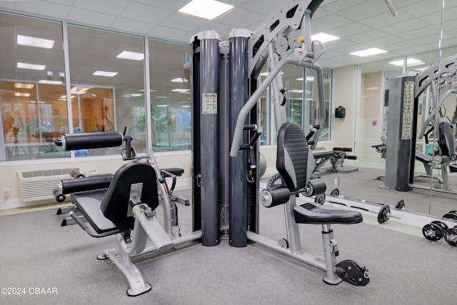 workout area featuring a drop ceiling