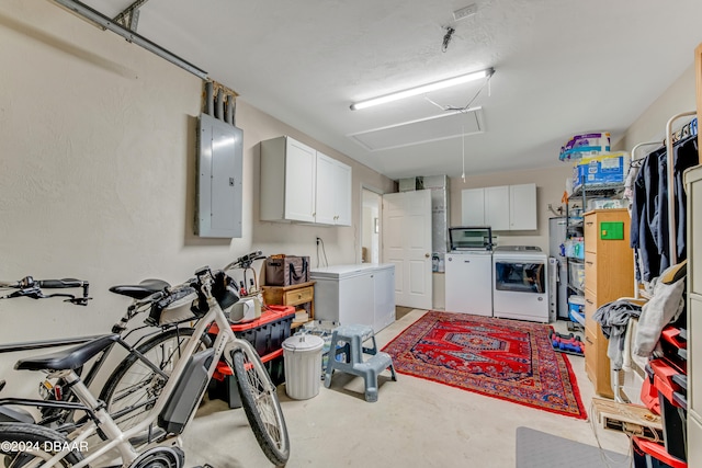 interior space featuring electric panel and separate washer and dryer