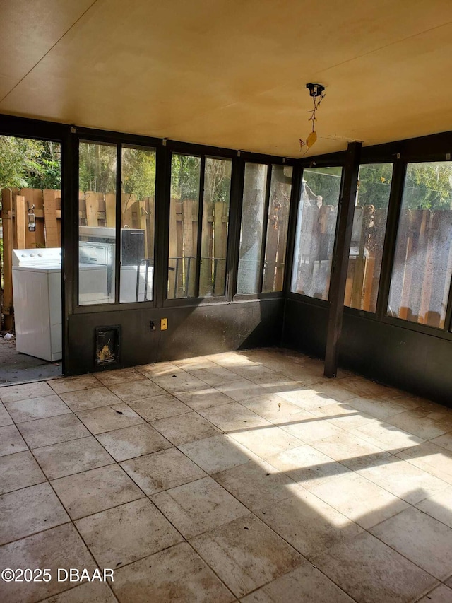 unfurnished sunroom with washer / clothes dryer