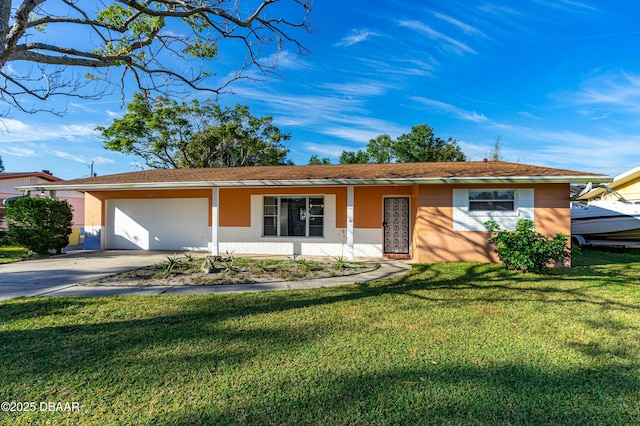 single story home featuring a garage and a front yard