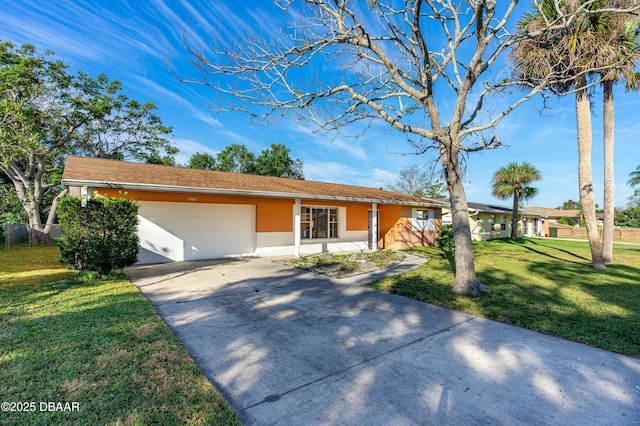 ranch-style house with a garage and a front lawn