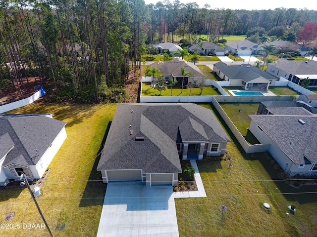 birds eye view of property with a residential view