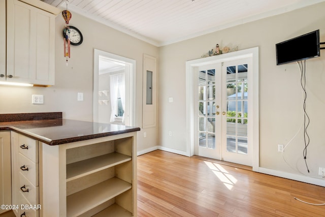 kitchen with french doors, white cabinets, wooden ceiling, and light wood-type flooring