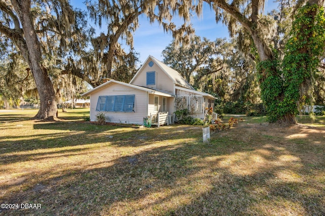 view of side of home featuring a yard