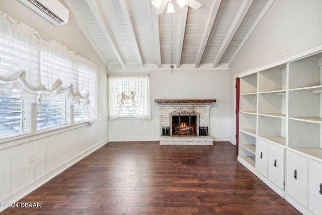 unfurnished living room with dark hardwood / wood-style floors, a brick fireplace, a wall mounted AC, and ceiling fan