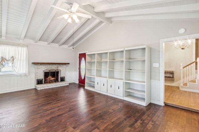 unfurnished living room featuring a brick fireplace, ceiling fan with notable chandelier, heating unit, dark wood-type flooring, and vaulted ceiling with beams