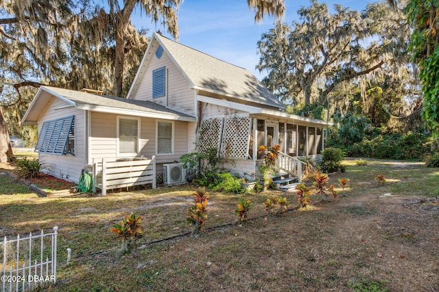 farmhouse inspired home featuring ac unit and a sunroom