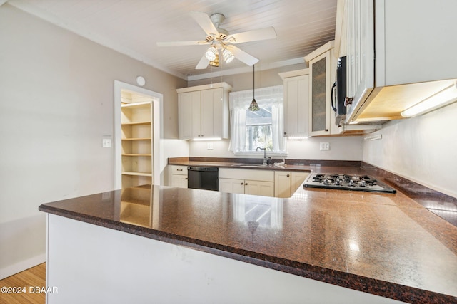 kitchen featuring white cabinets, sink, light wood-type flooring, kitchen peninsula, and stainless steel appliances