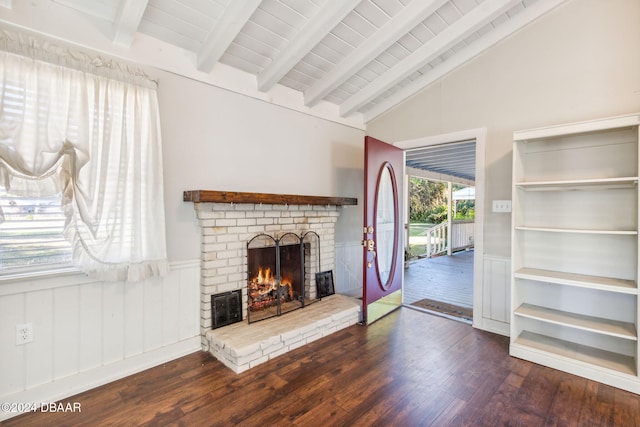 living room with a brick fireplace, vaulted ceiling with beams, dark hardwood / wood-style floors, wooden walls, and wood ceiling