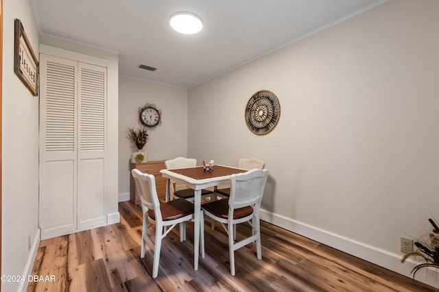 dining room with wood-type flooring