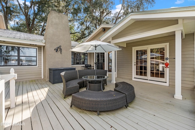 wooden terrace featuring an outdoor hangout area