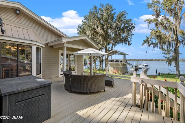 wooden deck featuring a water view