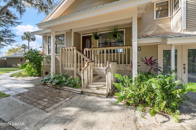 doorway to property with a porch