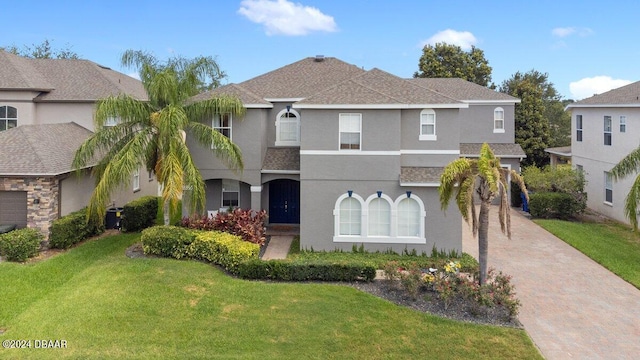 view of front facade featuring a garage and a front yard