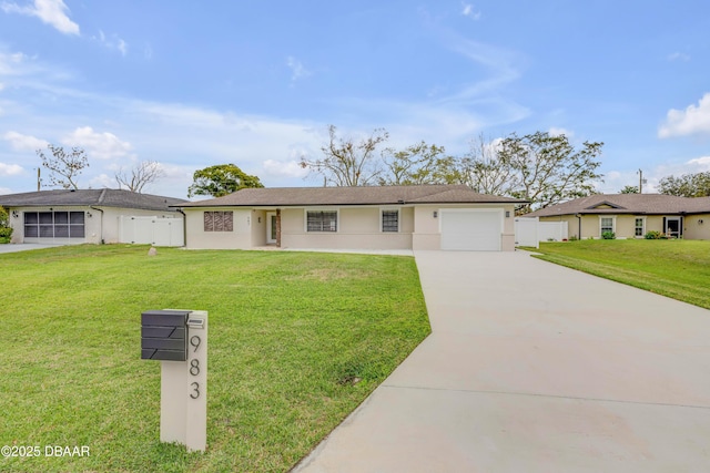 ranch-style house with a garage, concrete driveway, and a front lawn