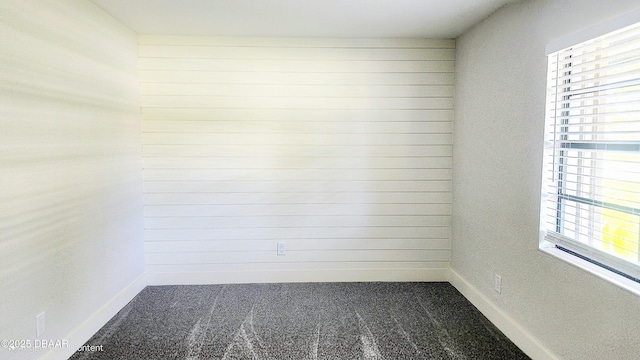779 Aspen Dr, South Daytona, FL 32119 - unfurnished room featuring carpet flooring, healthy amount of natural light, and baseboards