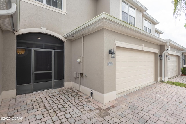 253 Catriona Dr, Daytona Beach, FL 32124 - exterior space with a garage and stucco siding