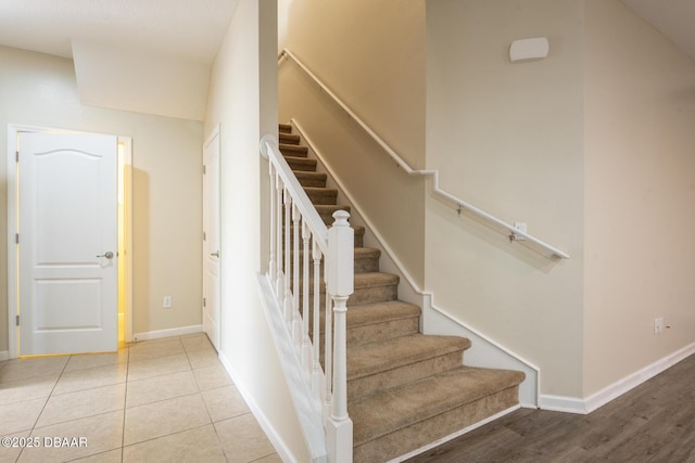 253 Catriona Dr, Daytona Beach, FL 32124 - staircase featuring tile patterned floors and baseboards