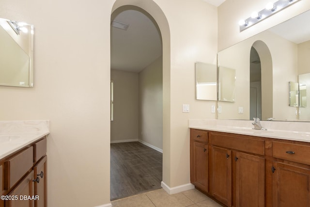 253 Catriona Dr, Daytona Beach, FL 32124 - full bath featuring two vanities, a sink, tile patterned flooring, and visible vents