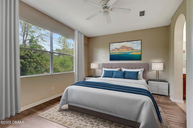 253 Catriona Dr, Daytona Beach, FL 32124 - bedroom with baseboards, arched walkways, and wood finished floors