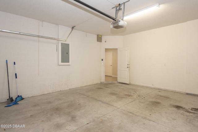 253 Catriona Dr, Daytona Beach, FL 32124 - garage with a garage door opener, concrete block wall, and electric panel