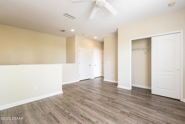 253 Catriona Dr, Daytona Beach, FL 32124 - unfurnished bedroom with visible vents, baseboards, a closet, recessed lighting, and wood finished floors