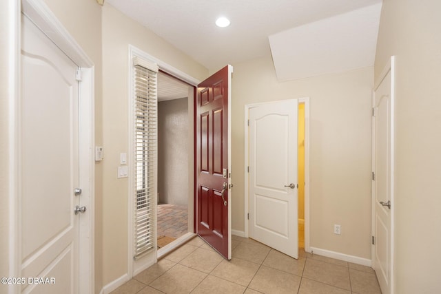 253 Catriona Dr, Daytona Beach, FL 32124 - entryway with recessed lighting, light tile patterned floors, and baseboards