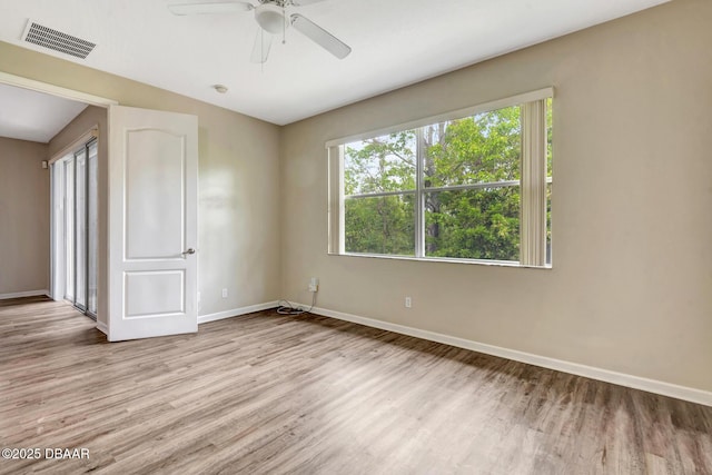 253 Catriona Dr, Daytona Beach, FL 32124 - empty room featuring light wood-type flooring, visible vents, baseboards, and a ceiling fan