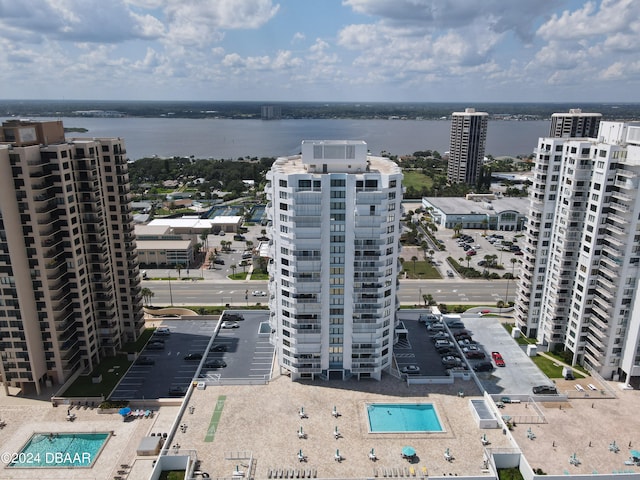 birds eye view of property with a water view