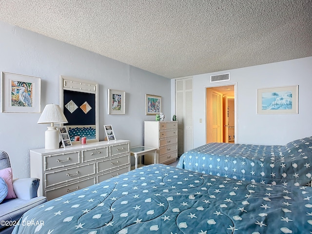 bedroom with a textured ceiling