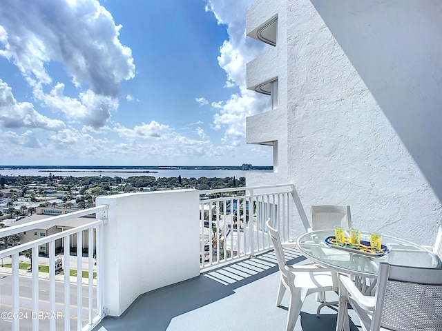 balcony featuring a water view