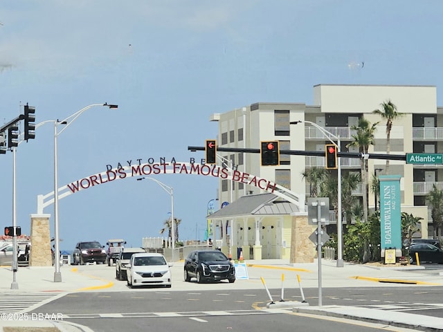 219 S Atlantic Ave Unit 428, Daytona Beach, FL 32118 - view of asphalt road featuring traffic lights, traffic signs, street lights, and sidewalks