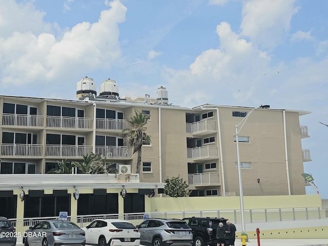 219 S Atlantic Ave Unit 428, Daytona Beach, FL 32118 - view of apartment building / complex with uncovered parking