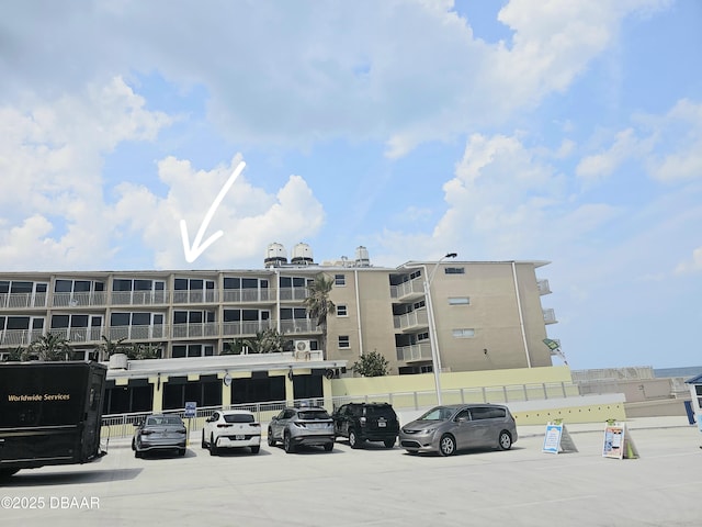 219 S Atlantic Ave Unit 428, Daytona Beach, FL 32118 - view of apartment building / complex with uncovered parking