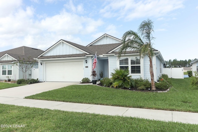 view of front of house featuring a garage and a front lawn