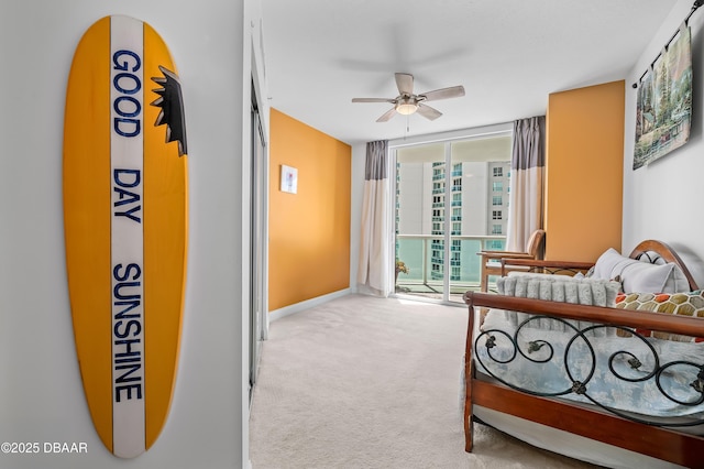 bedroom with baseboards, a wall of windows, ceiling fan, carpet floors, and access to outside