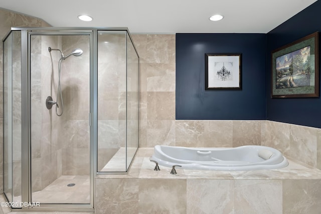 bathroom featuring recessed lighting, a stall shower, and a garden tub