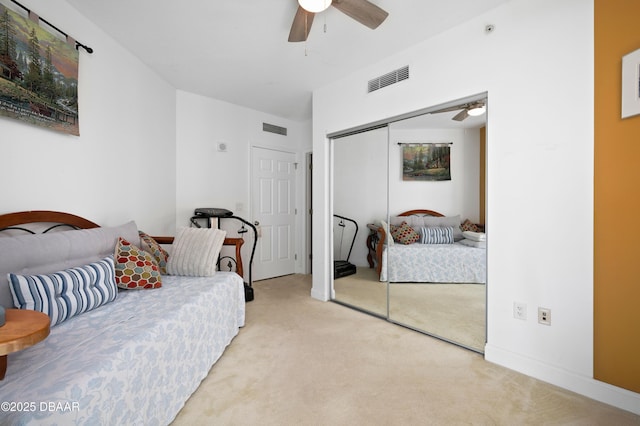bedroom with carpet, visible vents, a closet, and ceiling fan