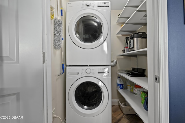 241 Riverside Dr Unit 1909, Holly Hill, FL 32117 - washroom with stacked washer / drying machine and wood finished floors