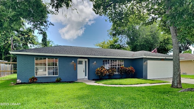 ranch-style house with a garage and a front lawn