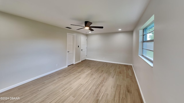 unfurnished room featuring ceiling fan and light wood-type flooring