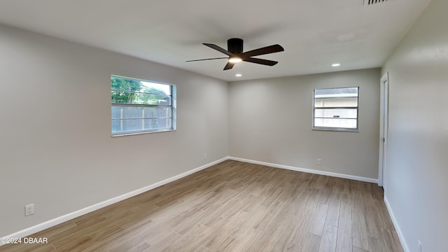 unfurnished room featuring ceiling fan and light hardwood / wood-style floors