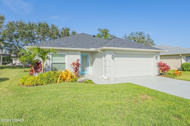 ranch-style home with a garage and a front yard