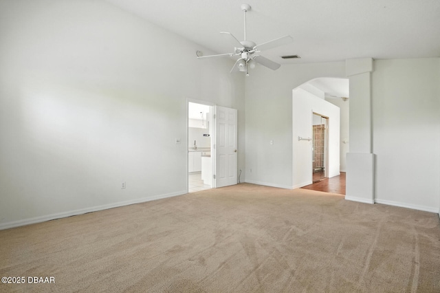 918 Brookridge Ln, Ormond Beach, FL 32174 - unfurnished bedroom featuring carpet floors, arched walkways, high vaulted ceiling, and ensuite bath