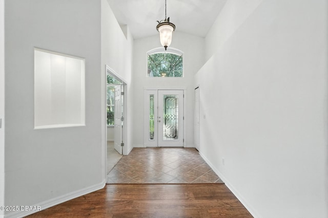 918 Brookridge Ln, Ormond Beach, FL 32174 - entrance foyer featuring high vaulted ceiling and wood finished floors