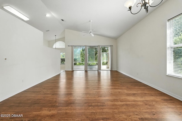 918 Brookridge Ln, Ormond Beach, FL 32174 - unfurnished living room with ceiling fan, wood finished floors, a chandelier, and high vaulted ceiling