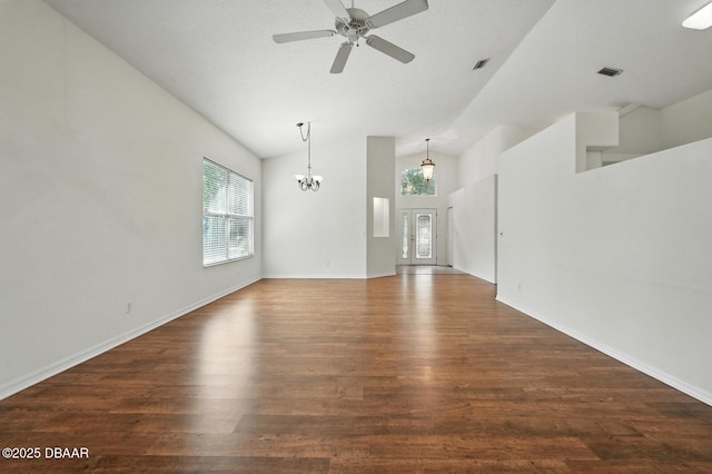 918 Brookridge Ln, Ormond Beach, FL 32174 - unfurnished living room with a chandelier, dark wood-type flooring, high vaulted ceiling, and ceiling fan