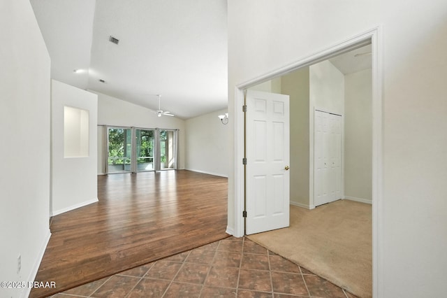 918 Brookridge Ln, Ormond Beach, FL 32174 - spare room with a ceiling fan, lofted ceiling, and tile patterned flooring