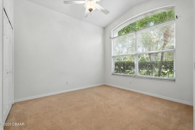 918 Brookridge Ln, Ormond Beach, FL 32174 - unfurnished bedroom with light carpet, lofted ceiling, ceiling fan, and a closet
