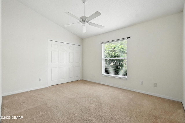 918 Brookridge Ln, Ormond Beach, FL 32174 - unfurnished bedroom with carpet, lofted ceiling, a closet, and a ceiling fan